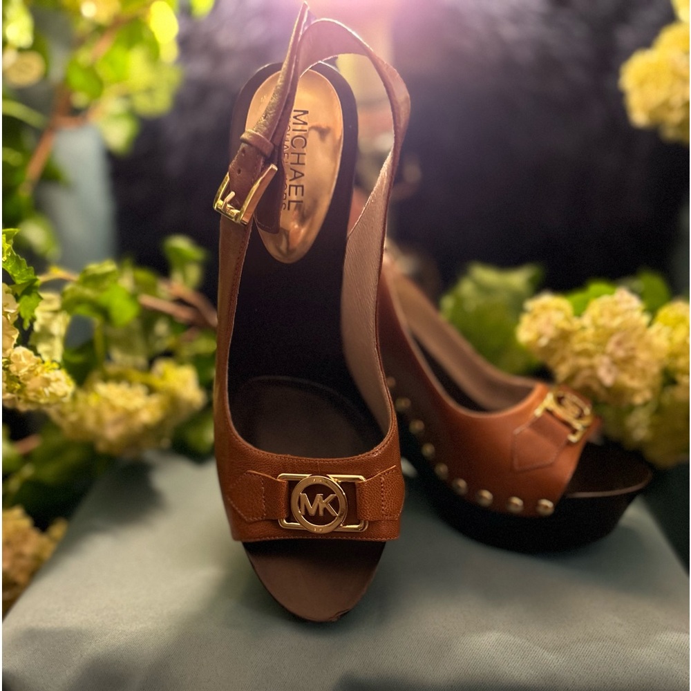 Brown women Michael Kors wedge heels.